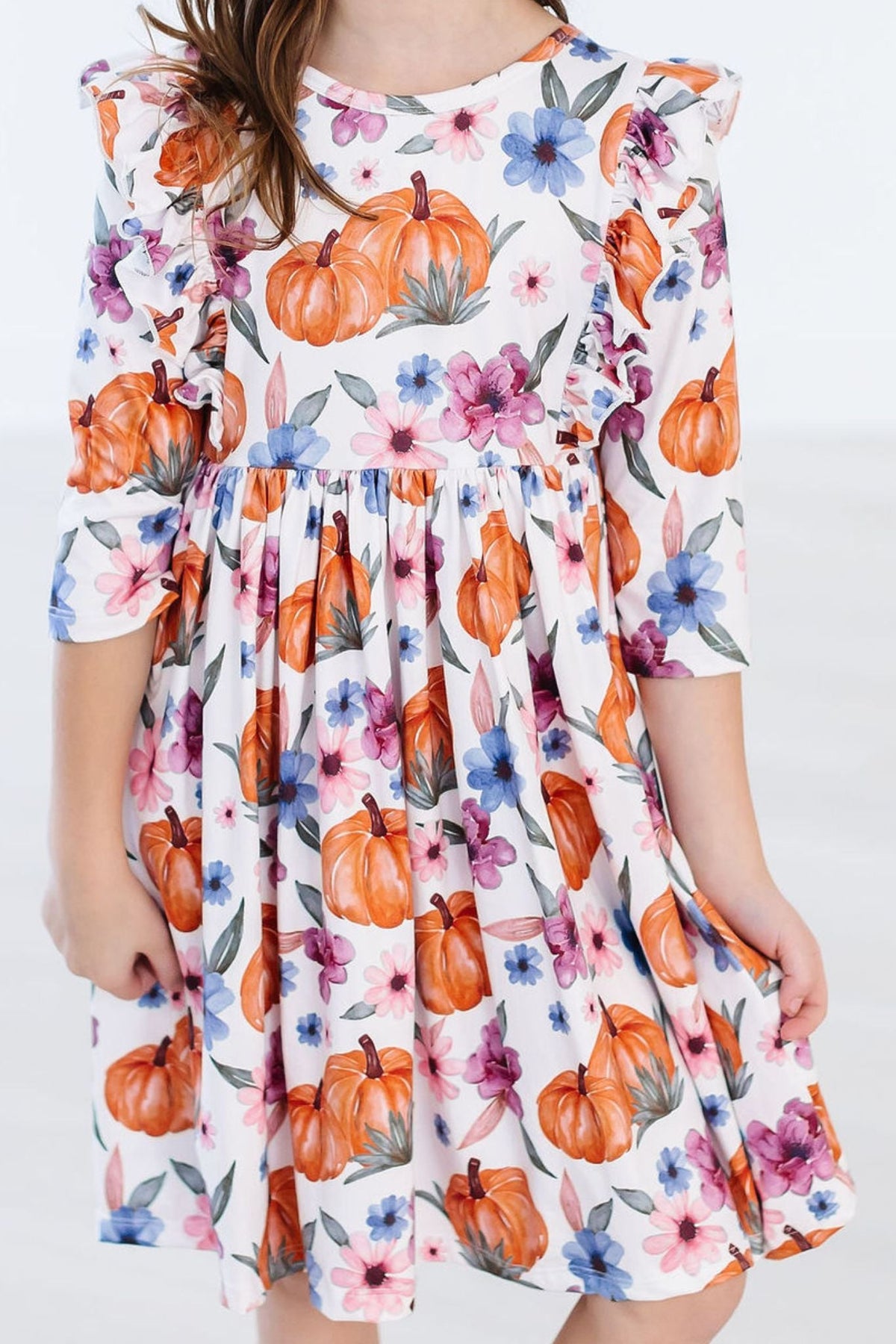 a girl wearing a floral dress
