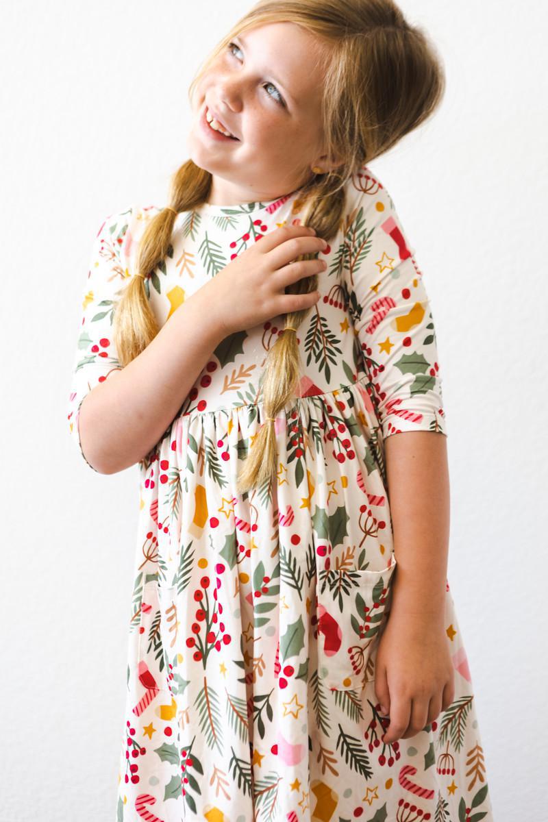 a girl with braids in a dress