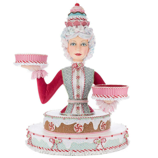 a statue of a woman holding two bowls