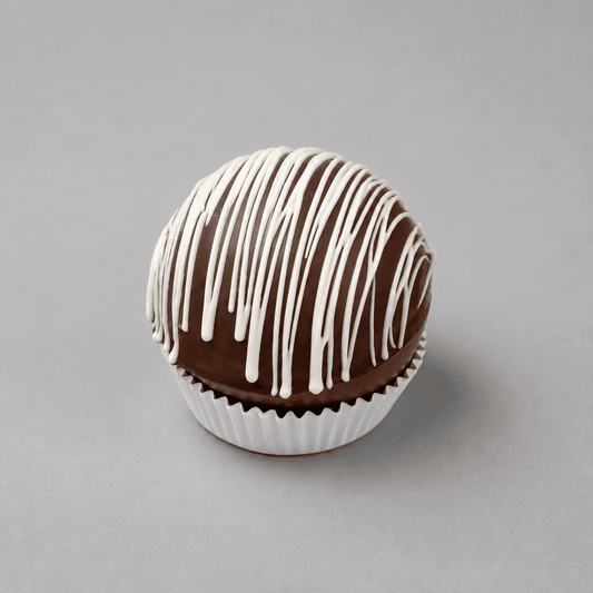 a chocolate ball with white icing
