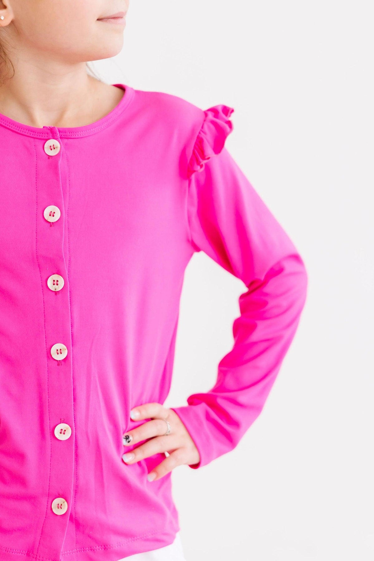 a woman wearing a pink shirt