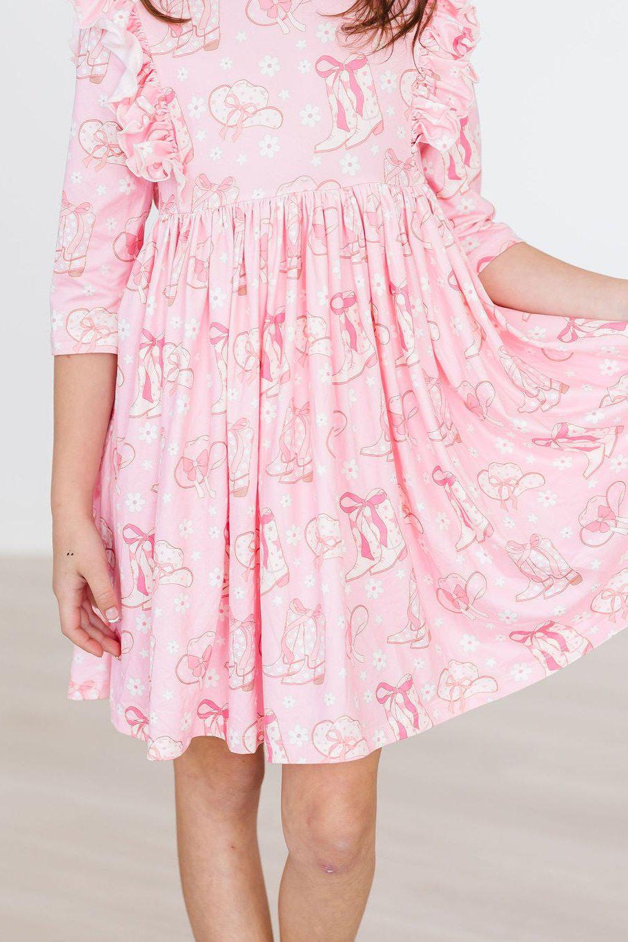 a girl wearing a pink dress