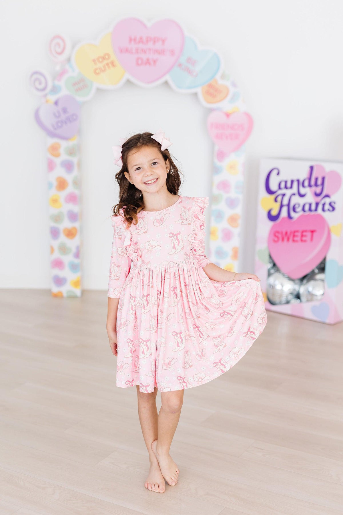 a girl in a pink dress