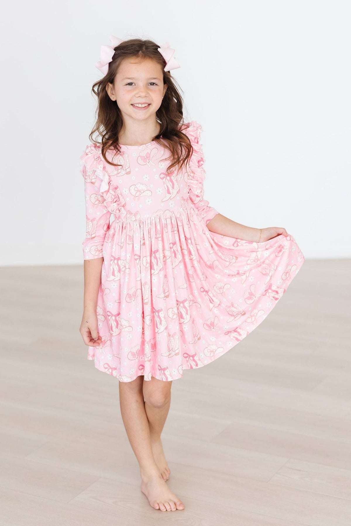 a girl in a pink dress