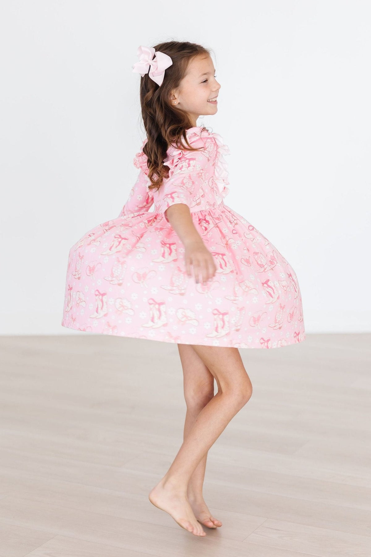 a girl in a pink dress