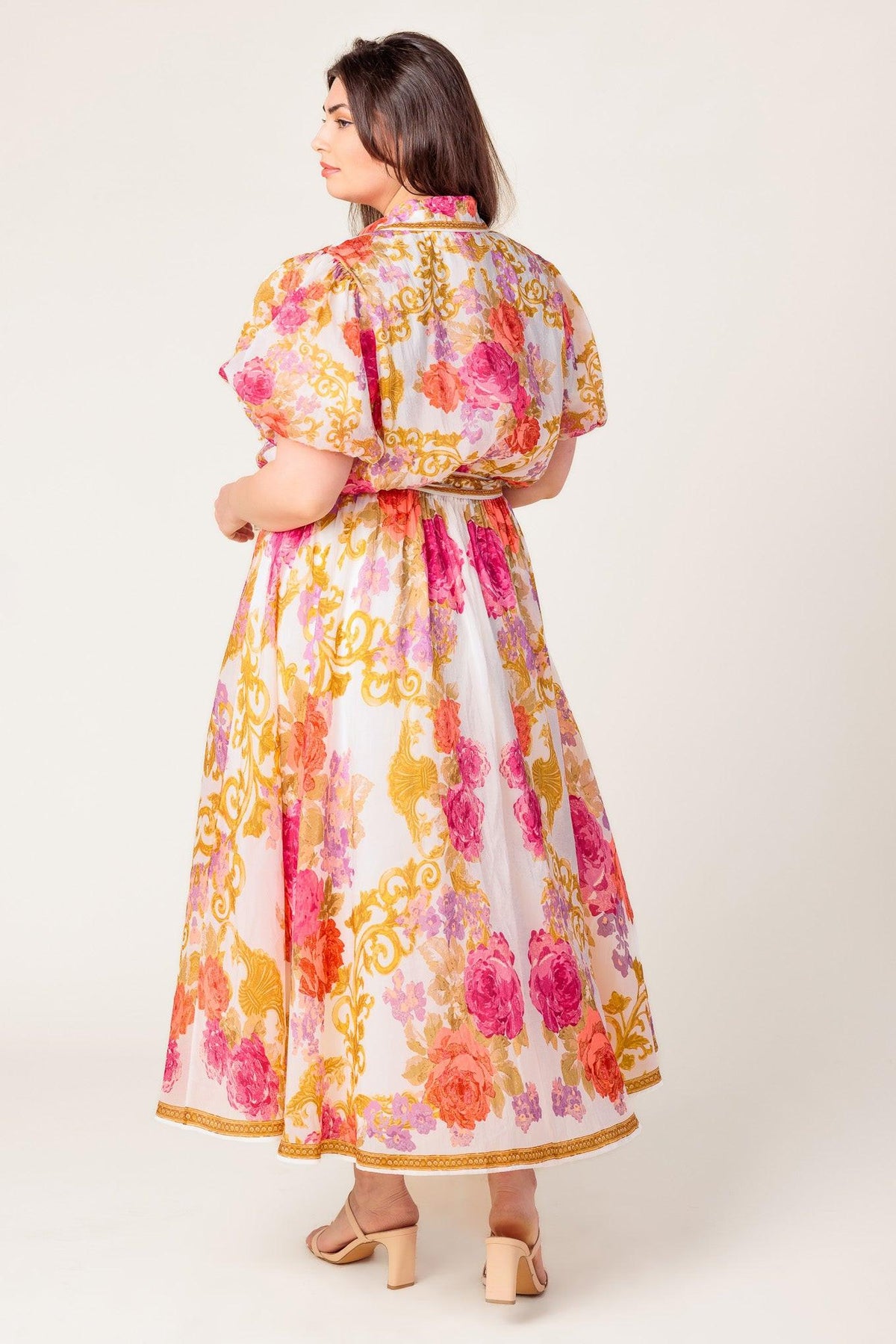 a woman in a floral dress
