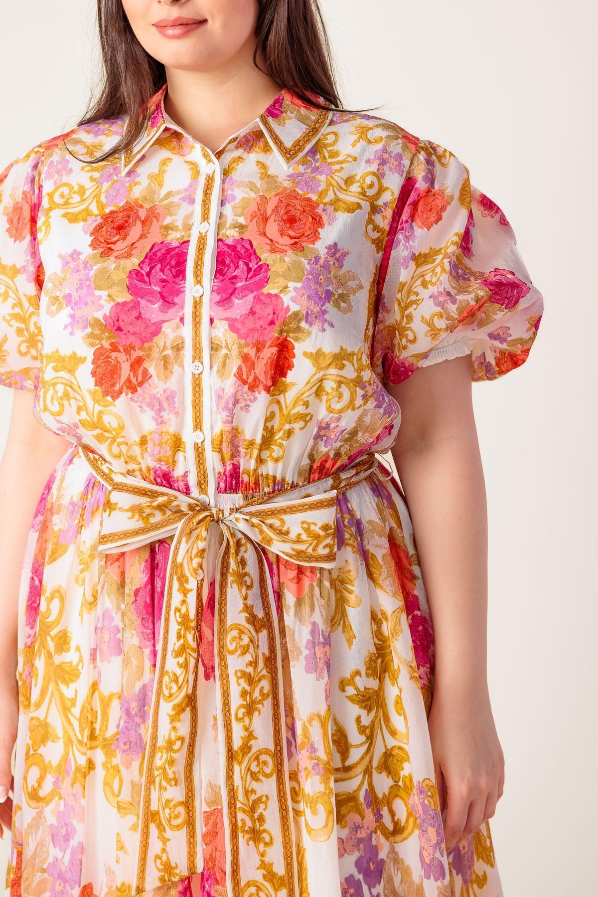 a woman wearing a floral dress