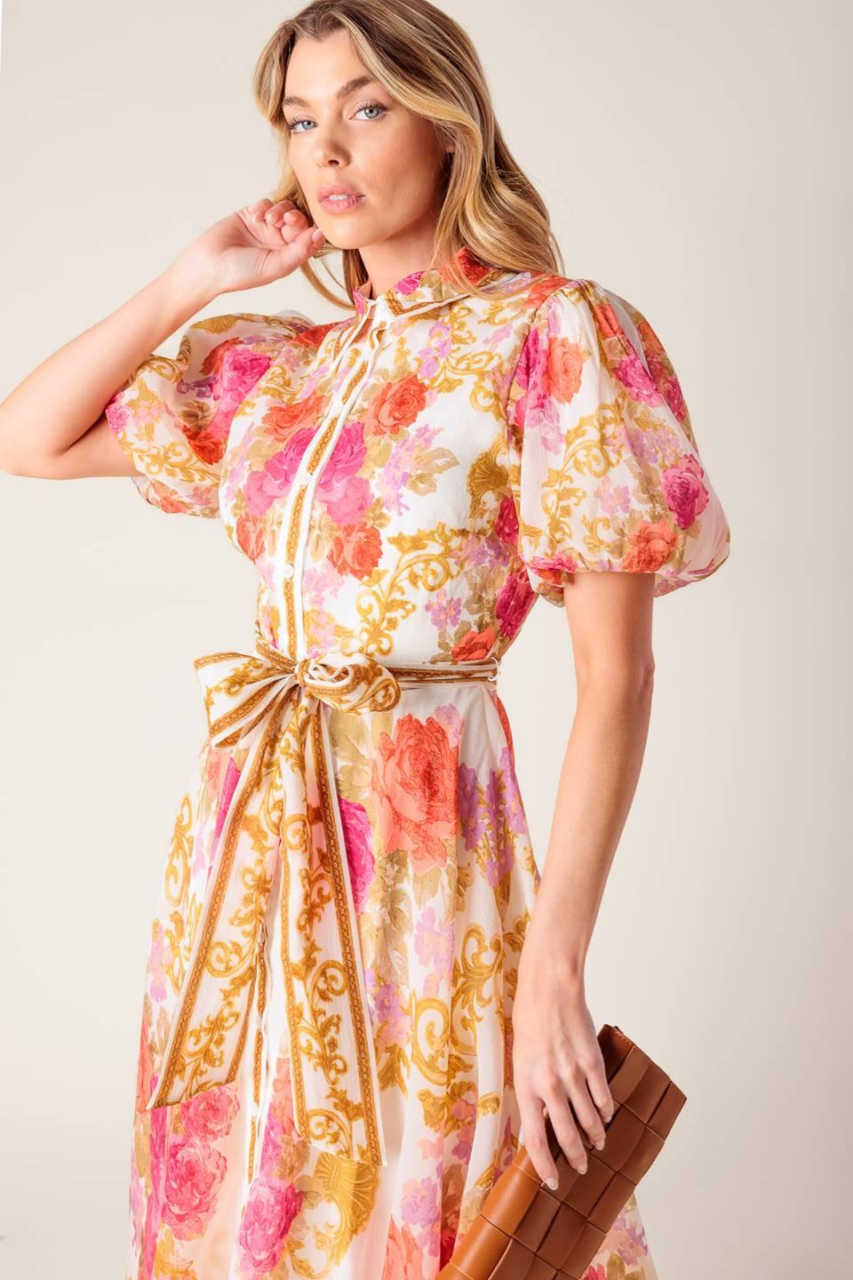 a woman in a floral dress