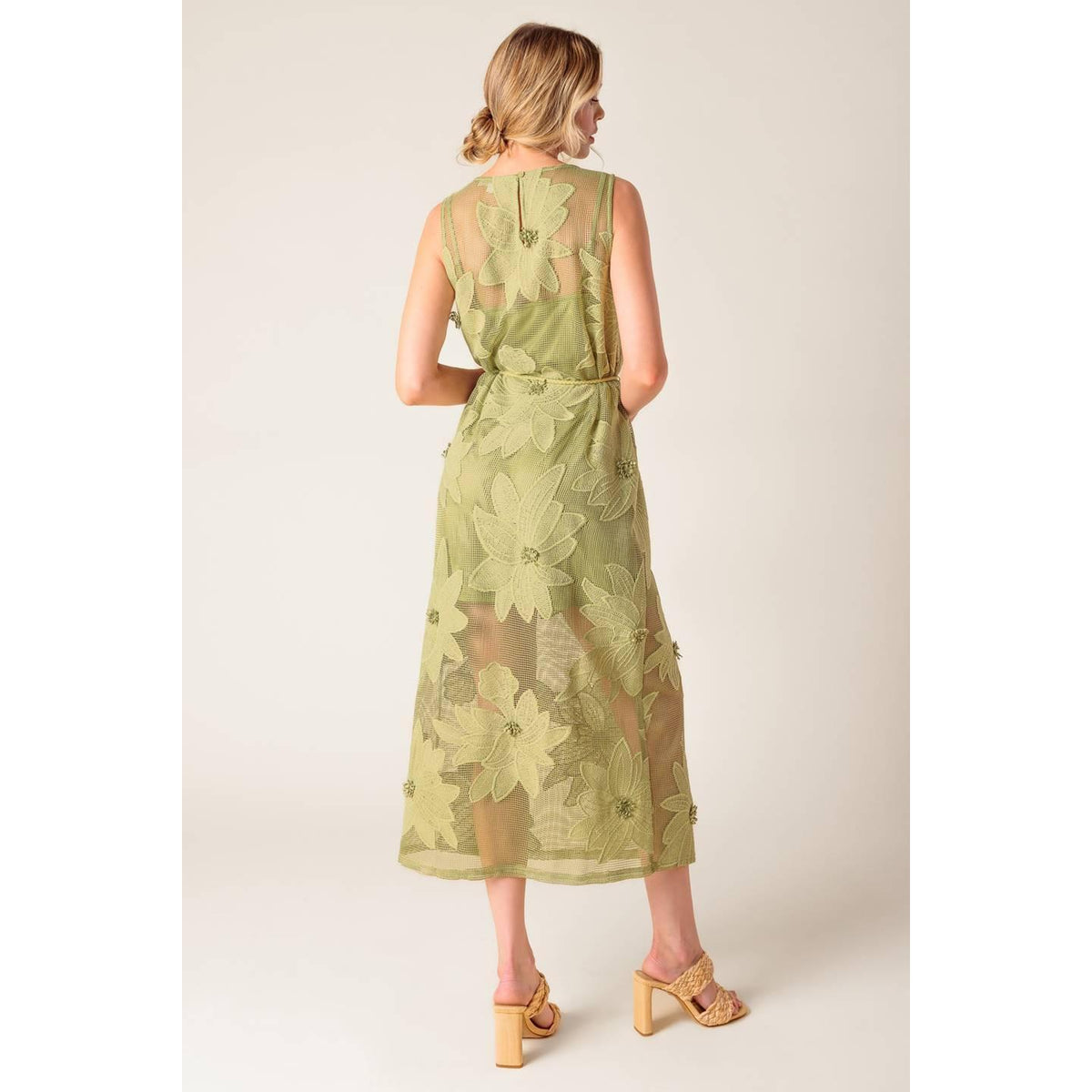 a woman in a green dress