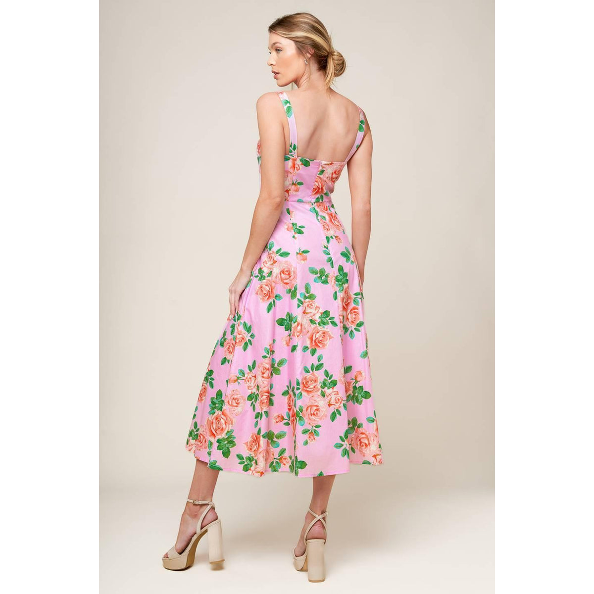 a woman in a pink dress