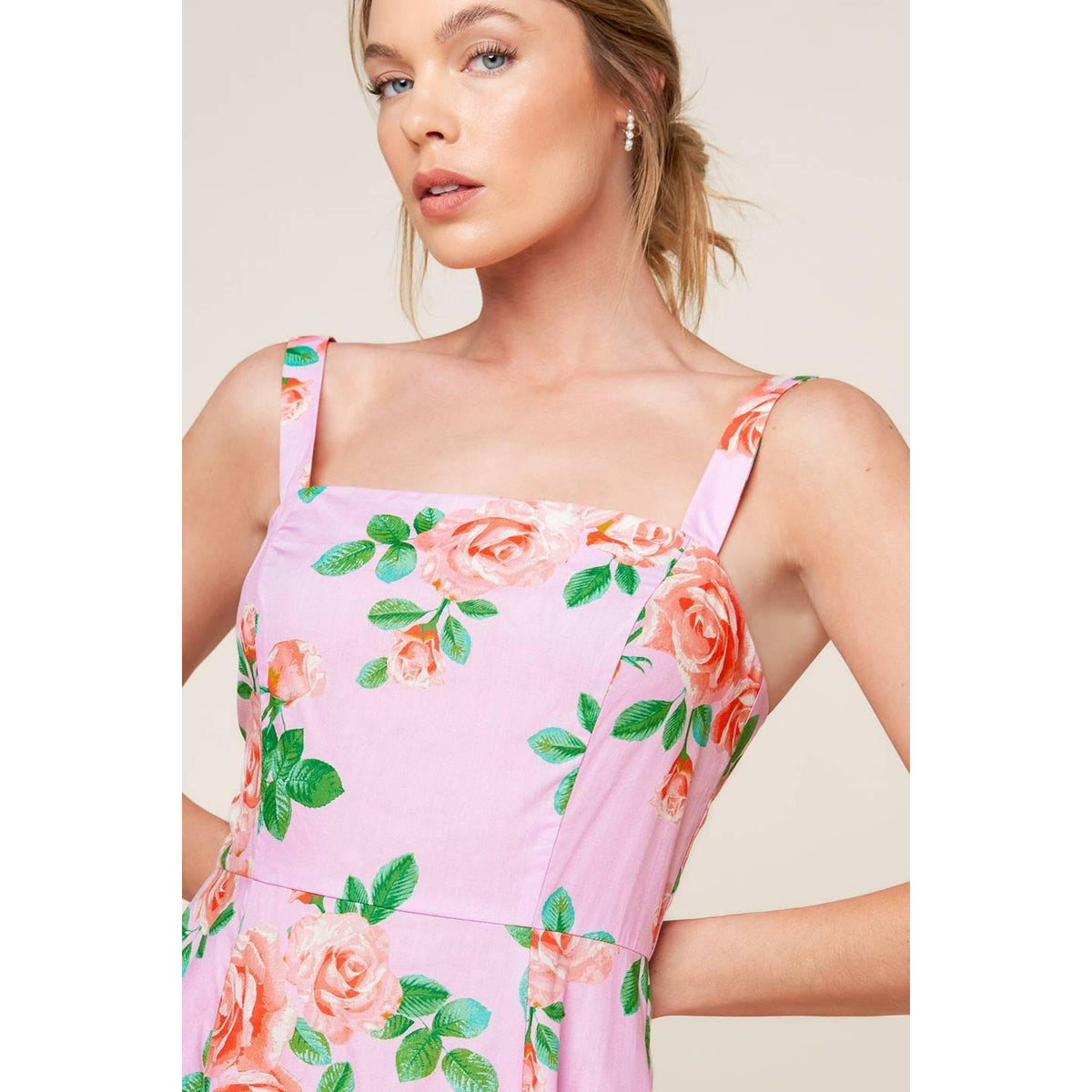 a woman in a pink dress