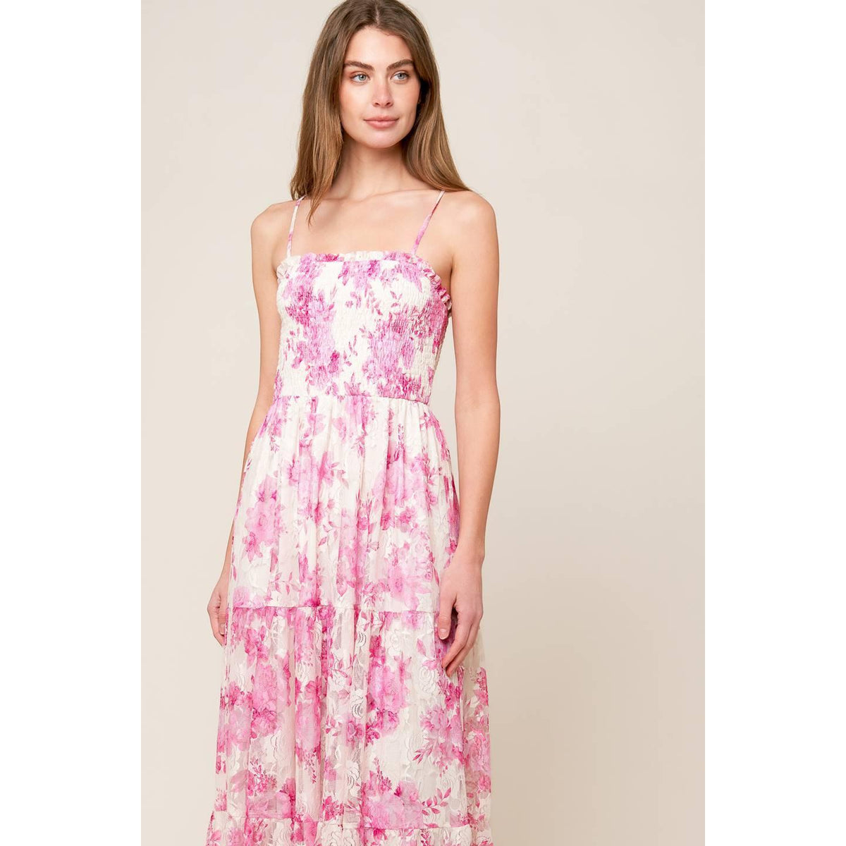 a woman in a pink and white dress