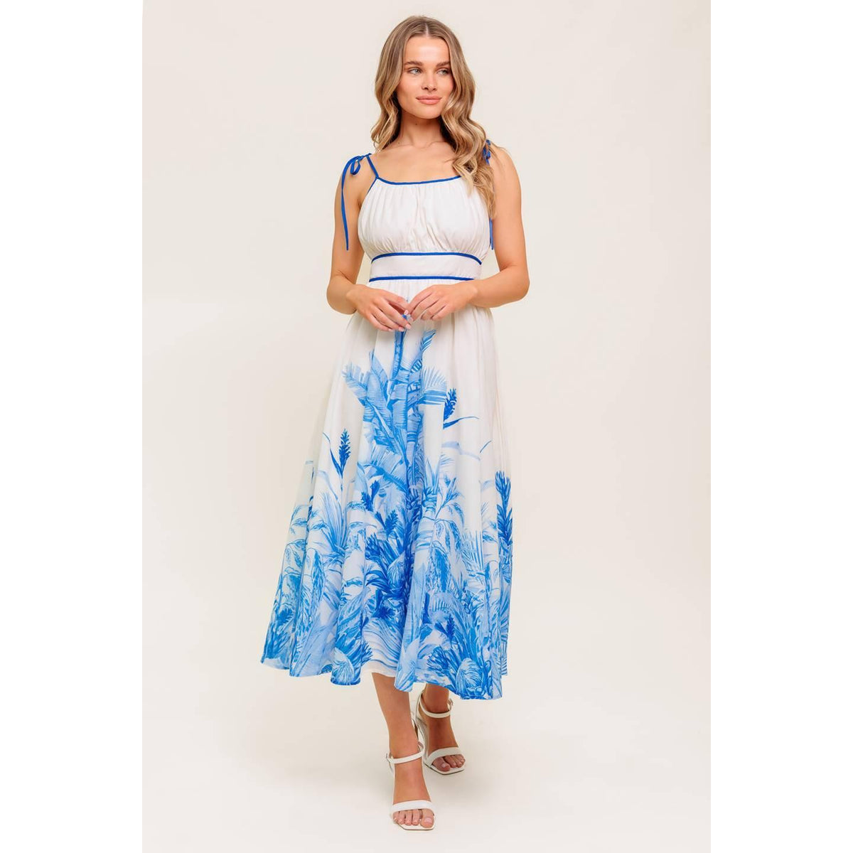 a woman in a white and blue dress