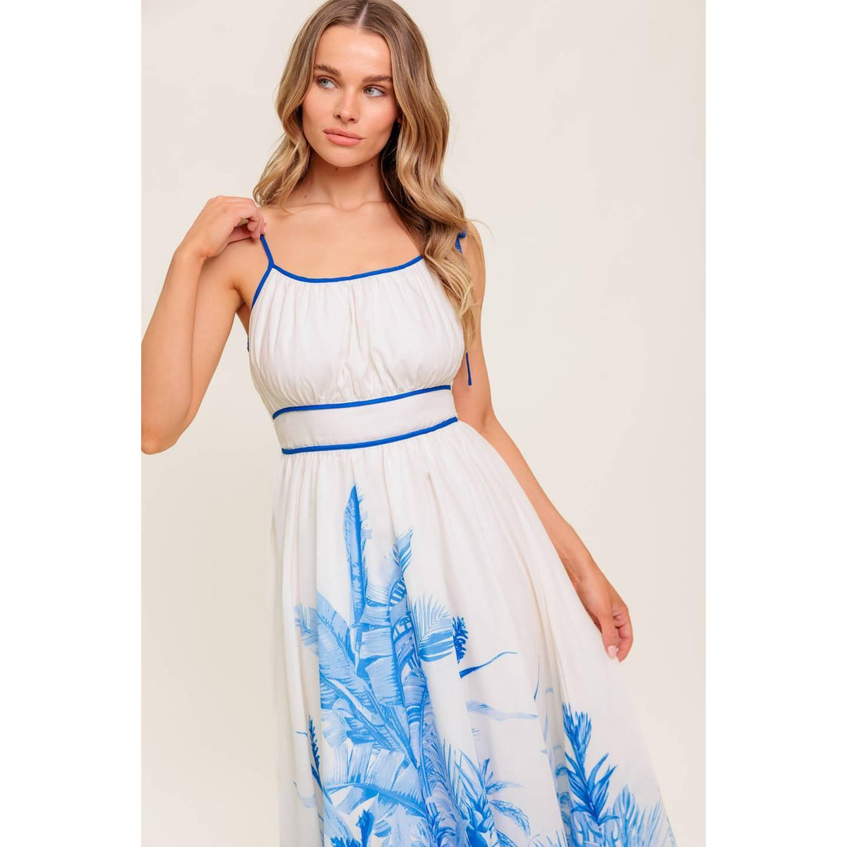 a woman in a white and blue dress