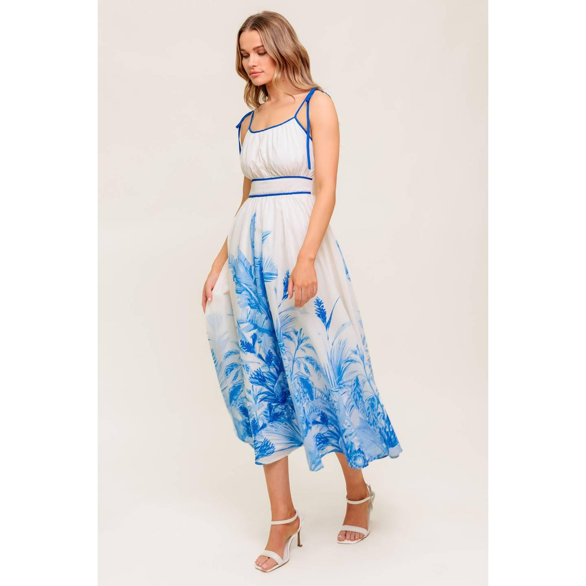 a woman in a white and blue dress