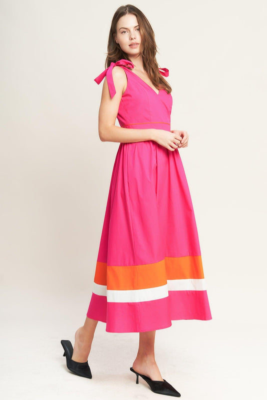 a woman in a pink dress