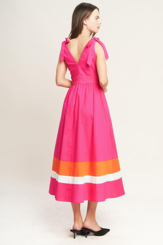 a woman in a pink dress