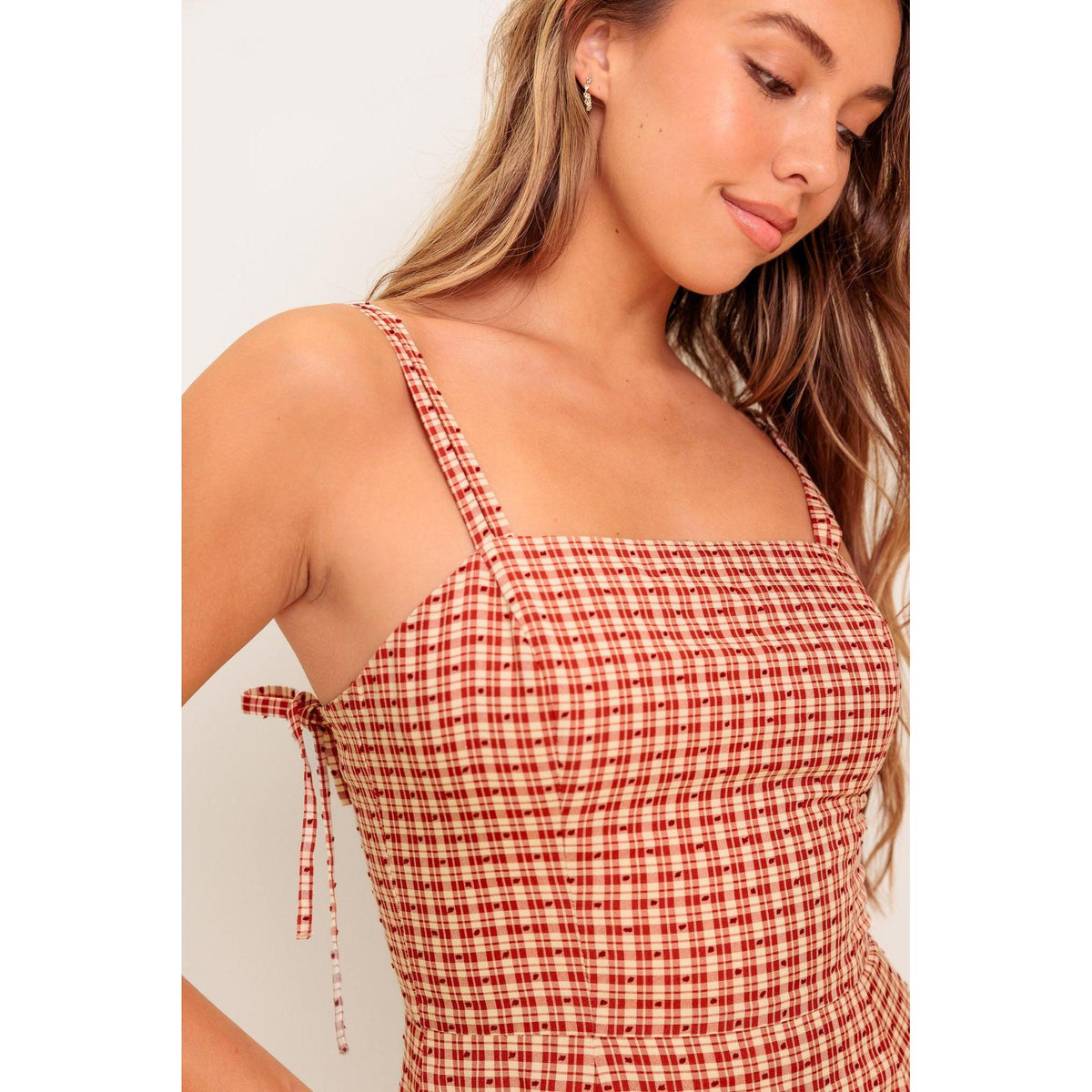 a woman in a plaid dress