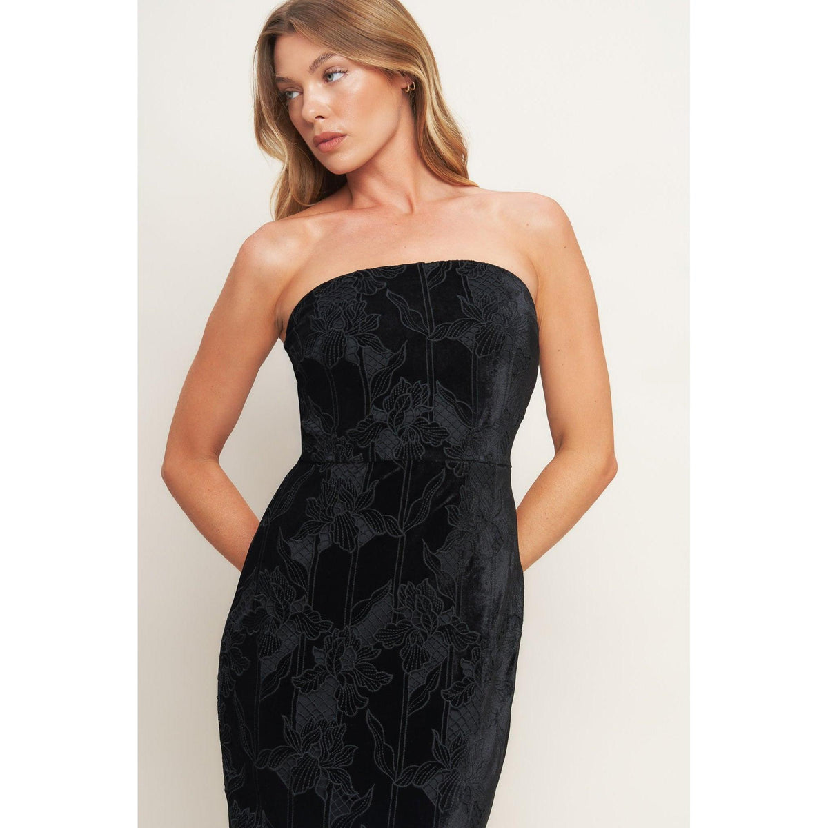 a woman in a black dress