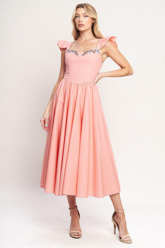 a woman in a pink dress