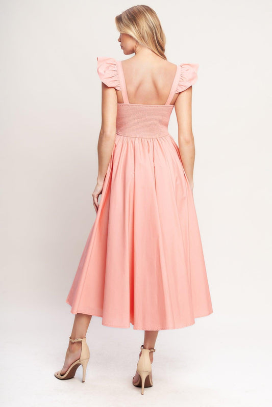 a woman in a pink dress