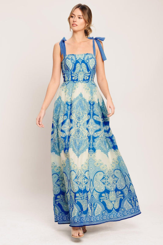 a woman in a blue and white dress