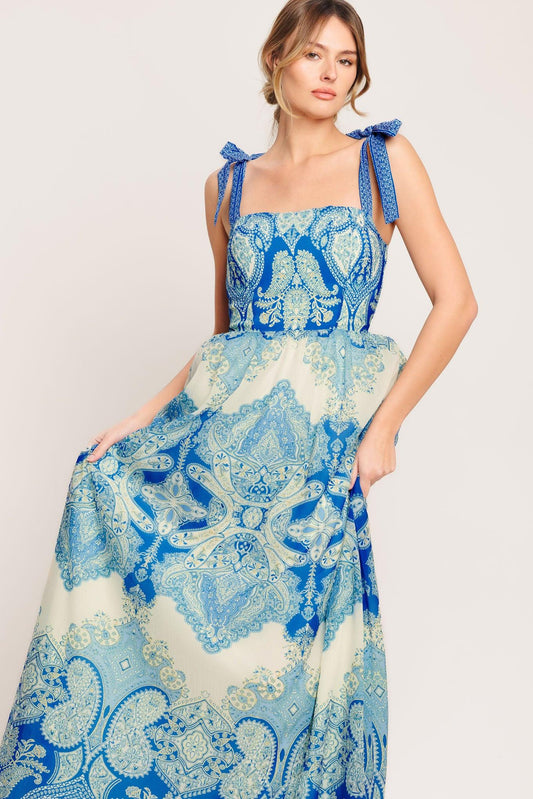 a woman in a blue and white dress