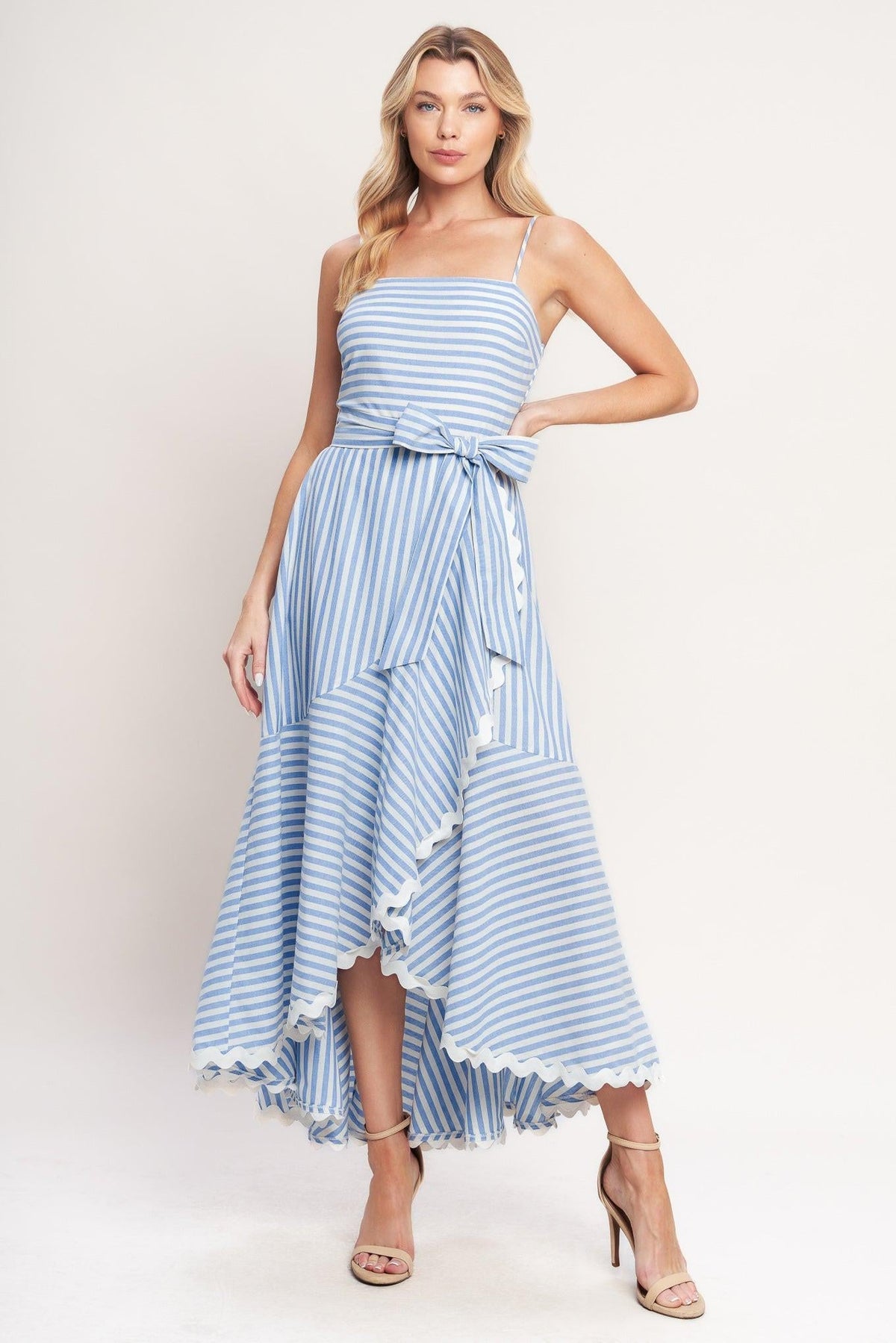 a woman in a blue and white striped dress