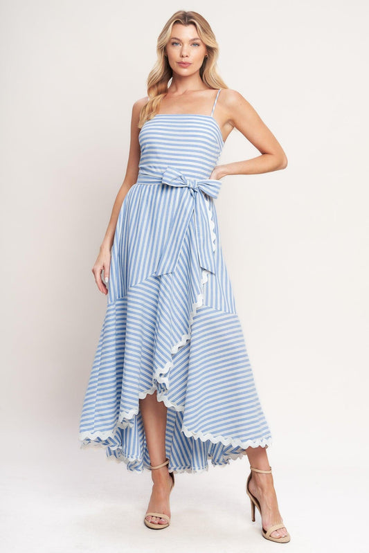 a woman in a blue and white striped dress