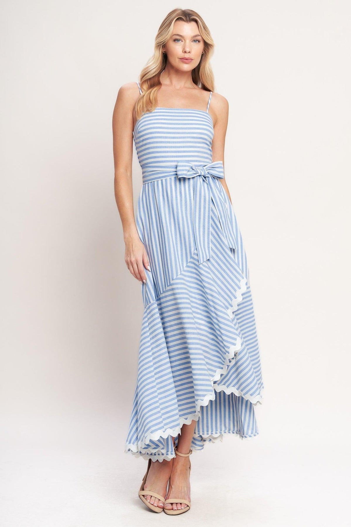 a woman in a blue and white striped dress