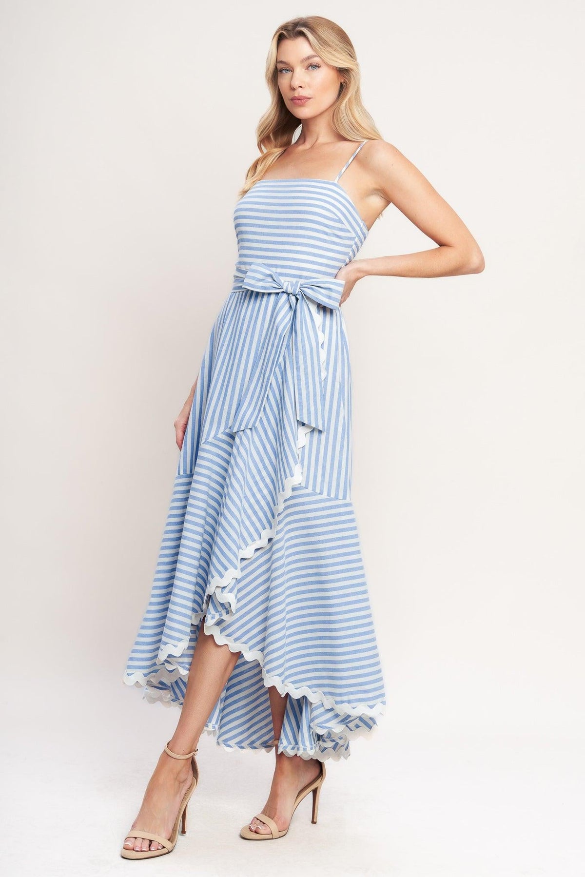a woman in a blue and white striped dress