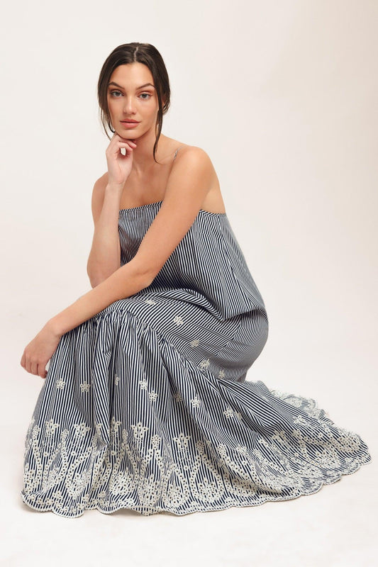 a woman in a striped dress