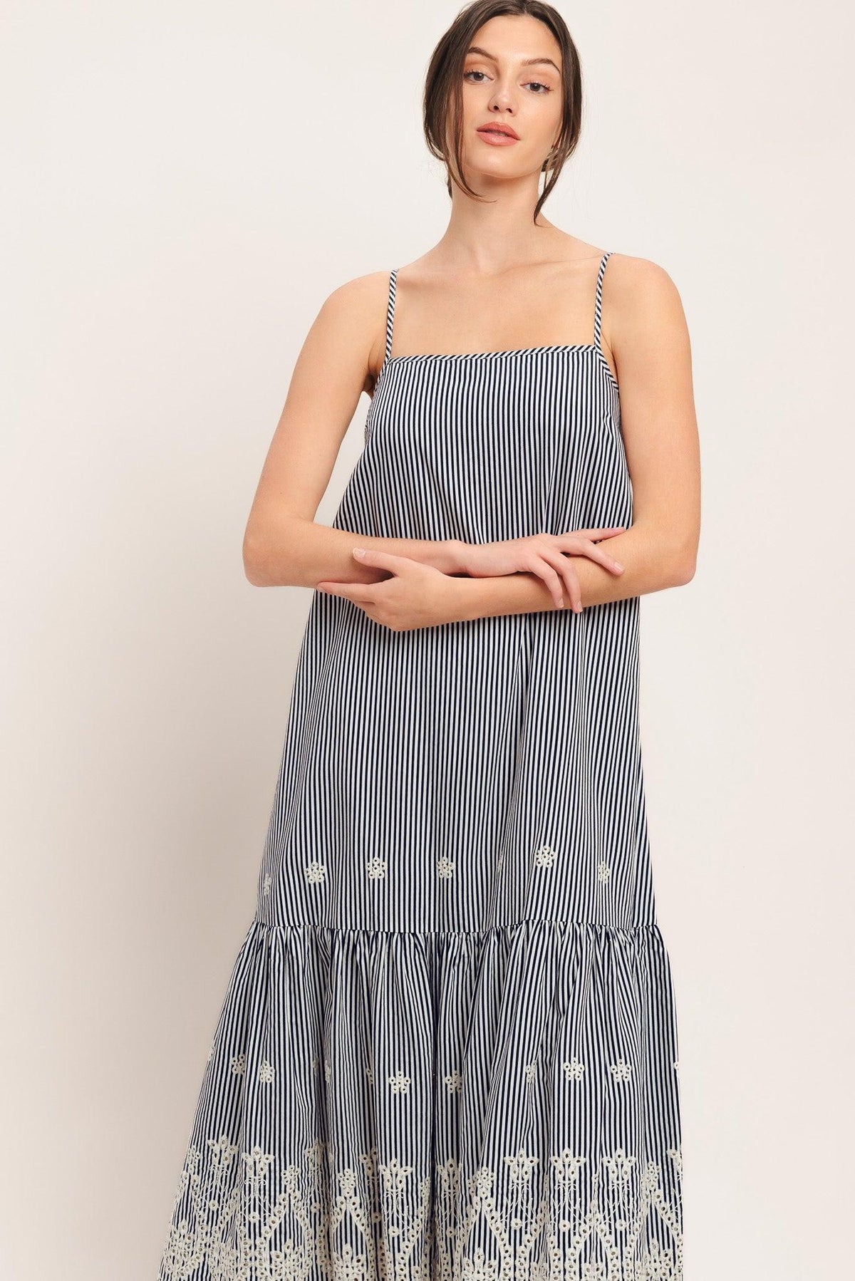 a woman in a striped dress