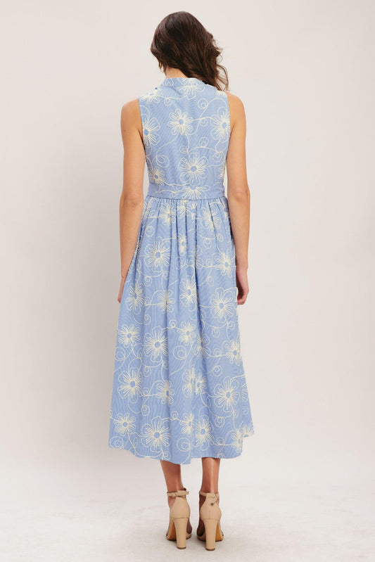a woman in a blue and white dress