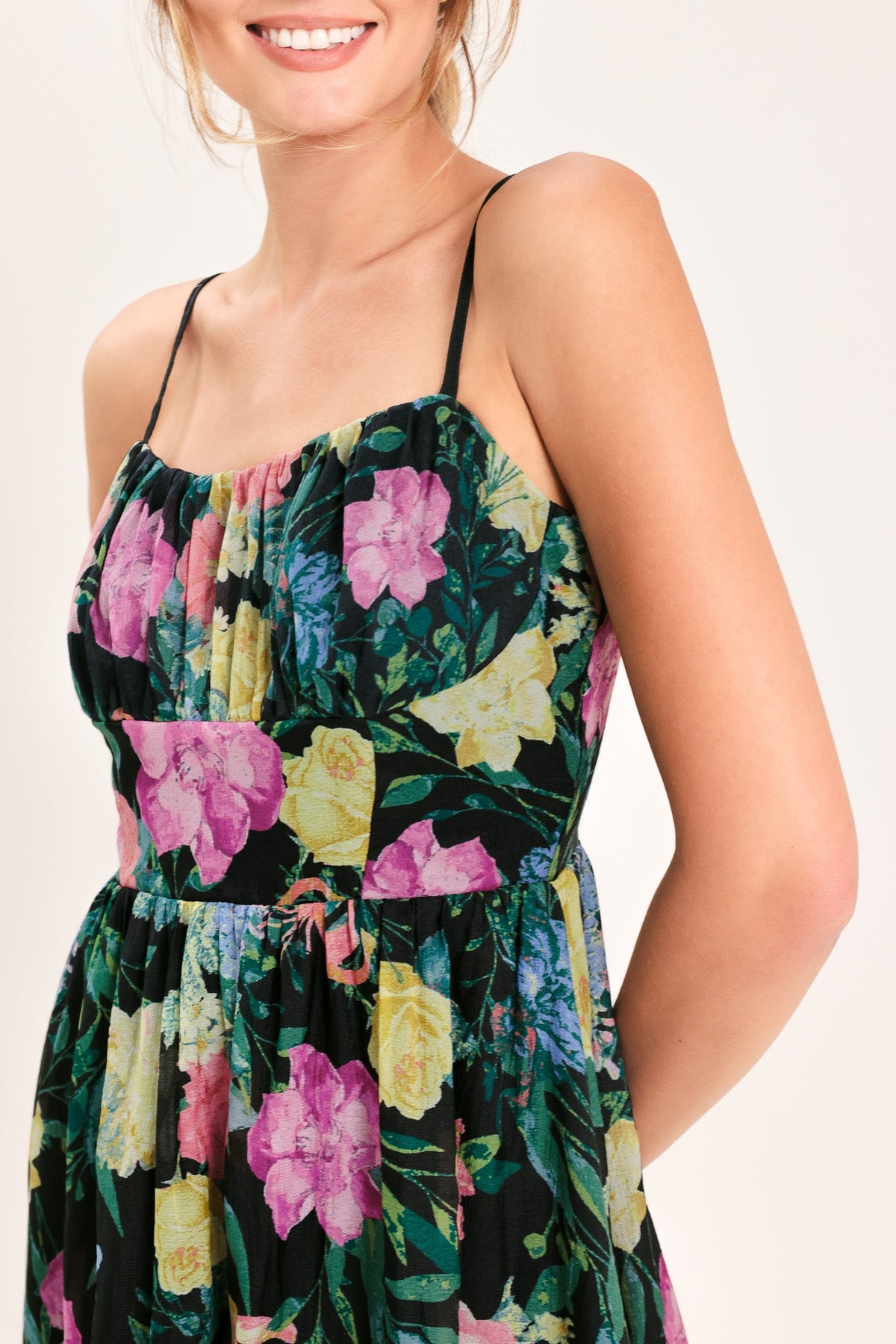 a woman wearing a floral dress