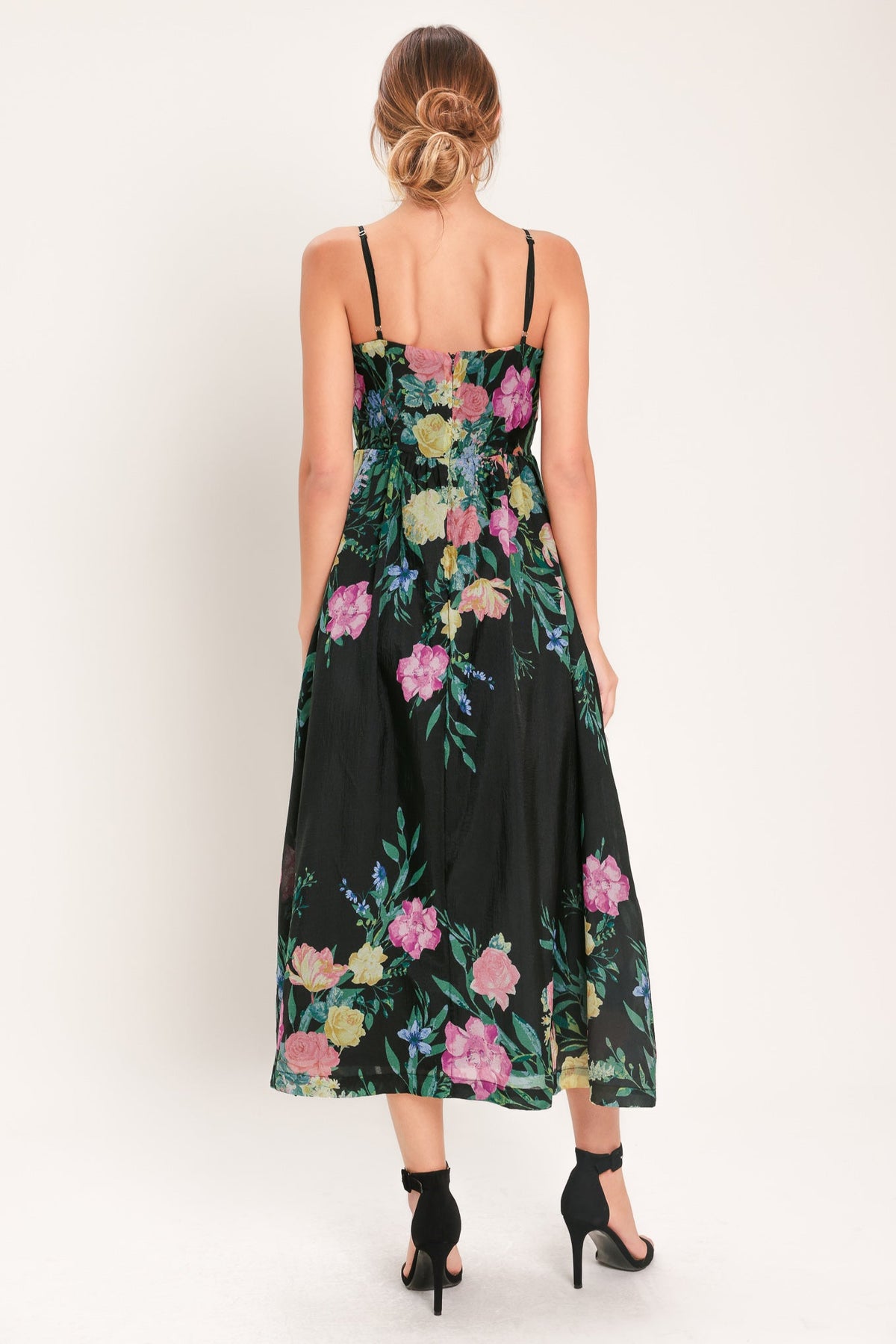 a woman in a floral dress