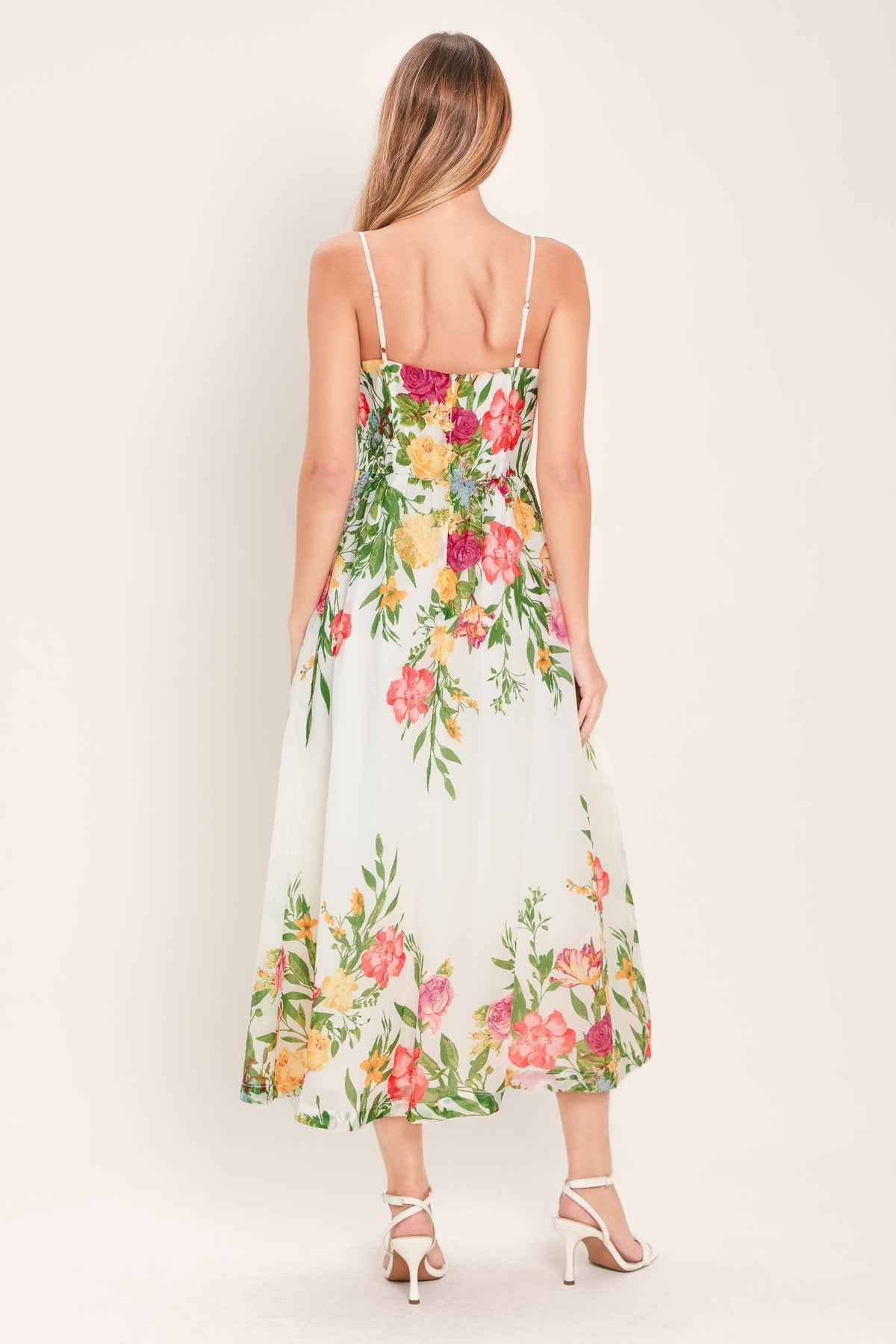 a woman in a floral dress