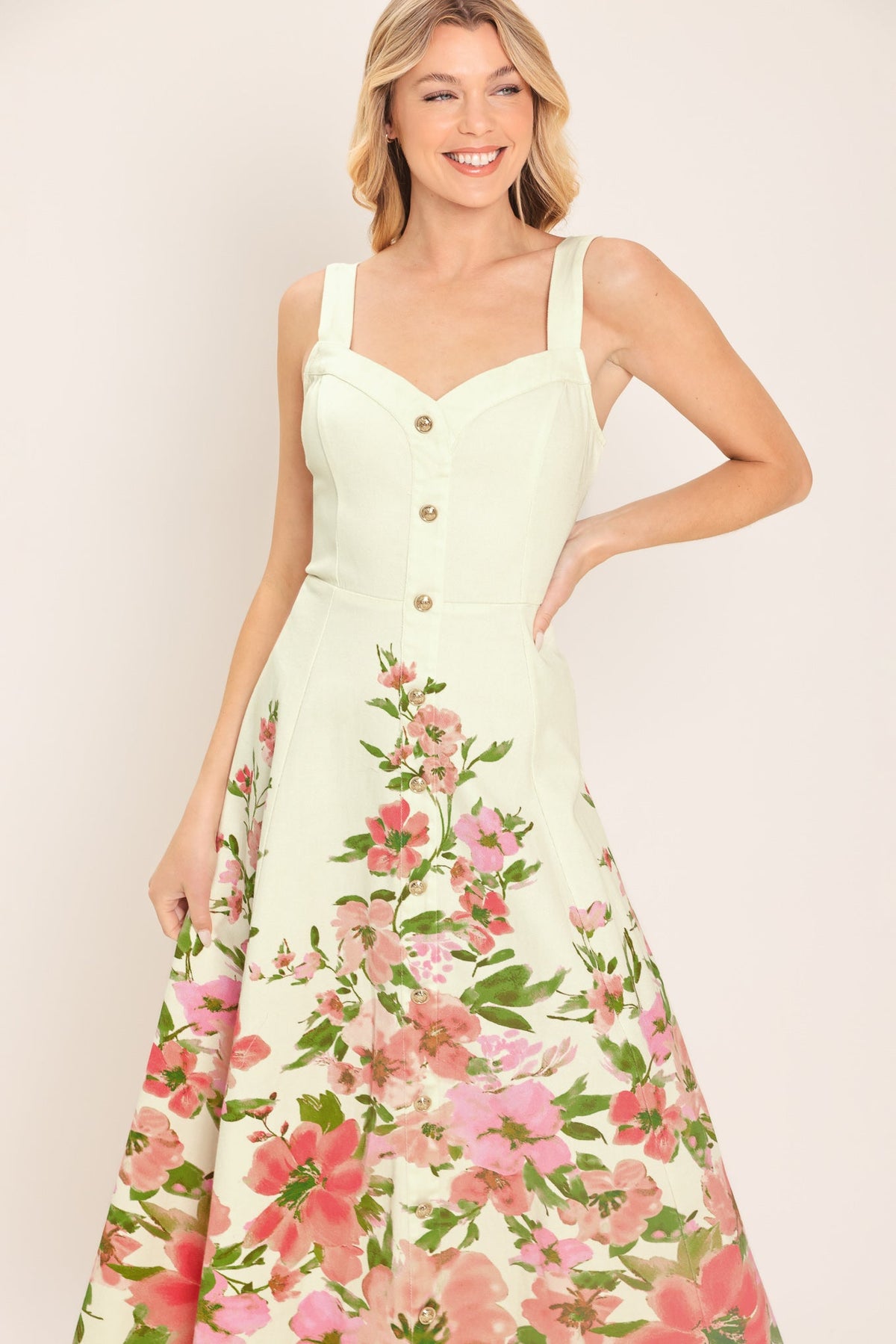 a woman in a white dress with pink flowers