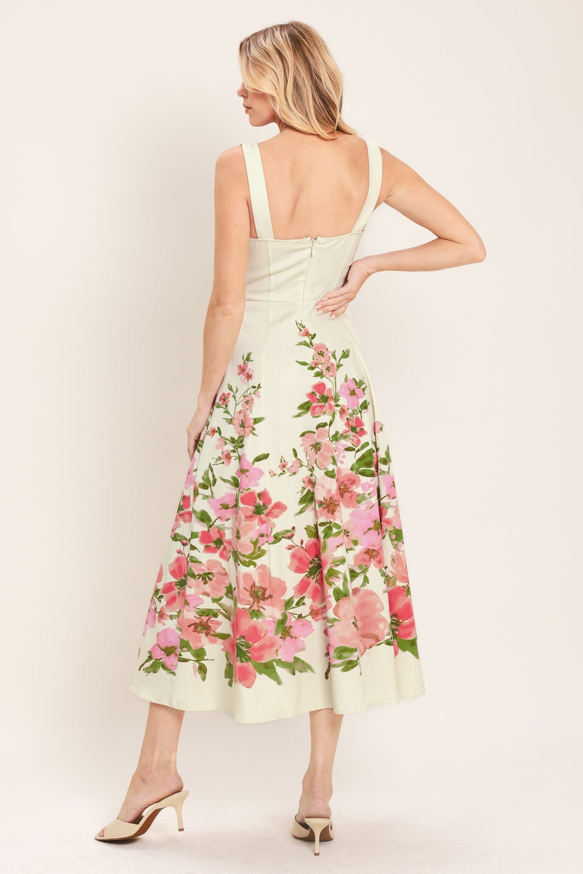 a woman in a floral dress