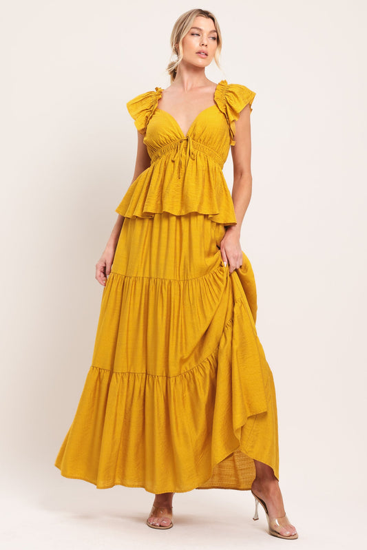 a woman in a yellow dress