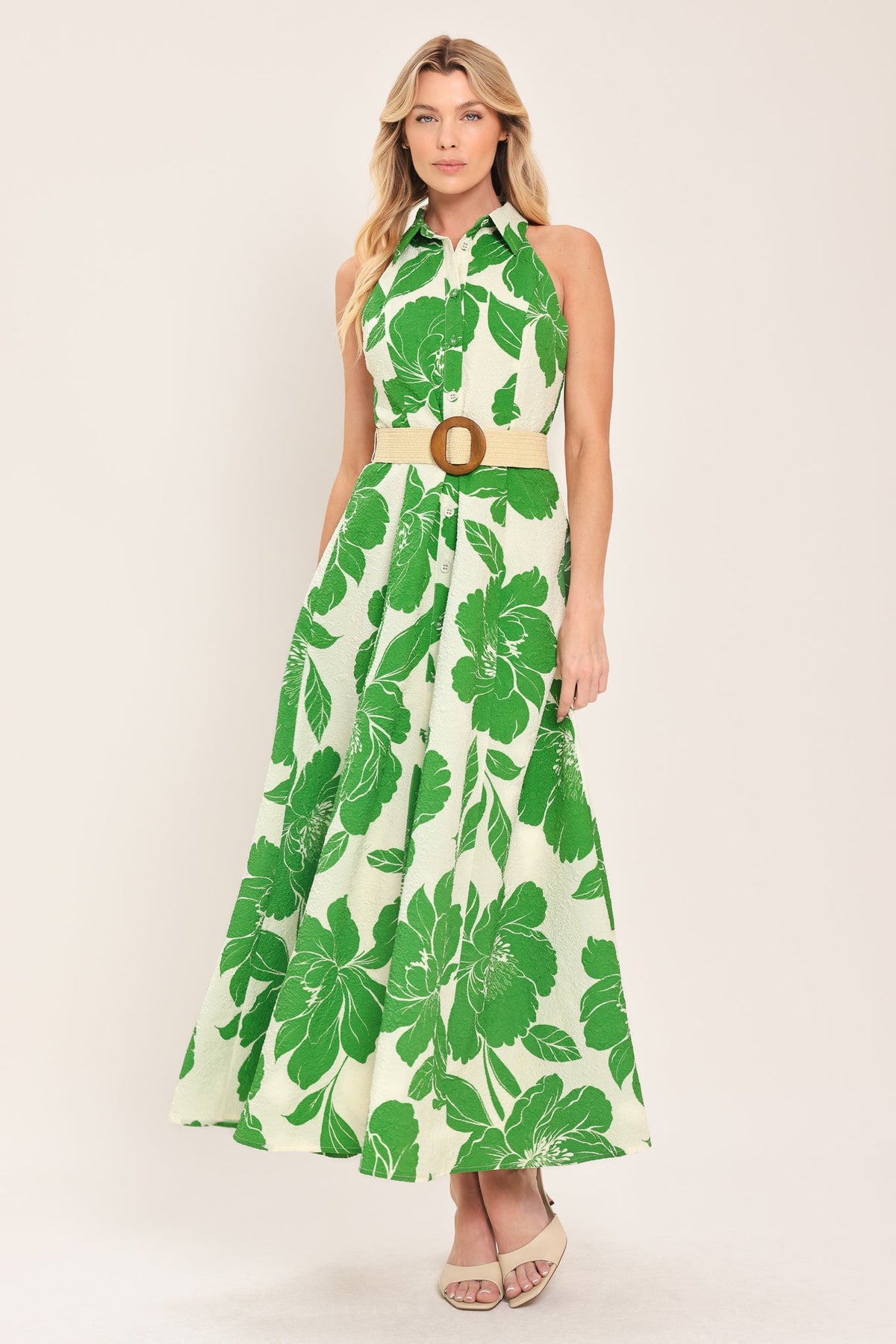 a woman in a green and white dress