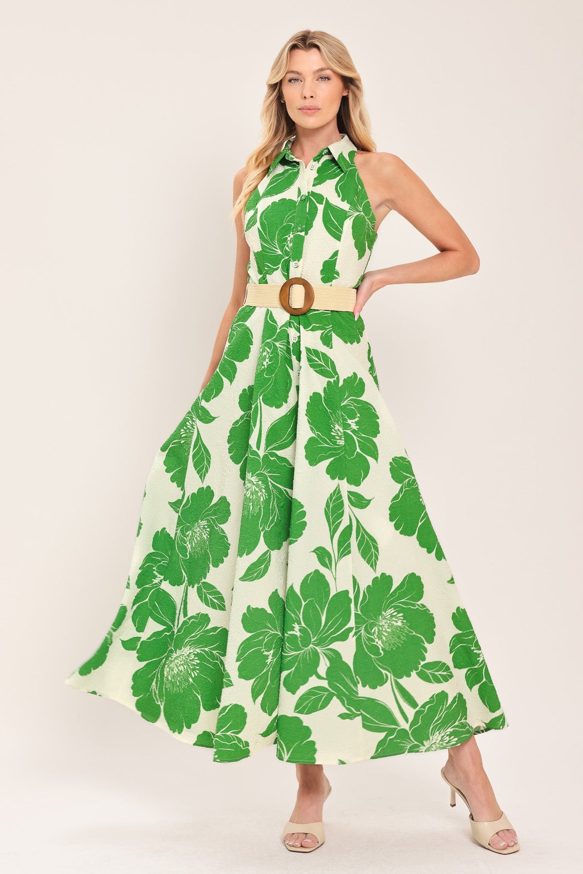 a woman in a green and white dress