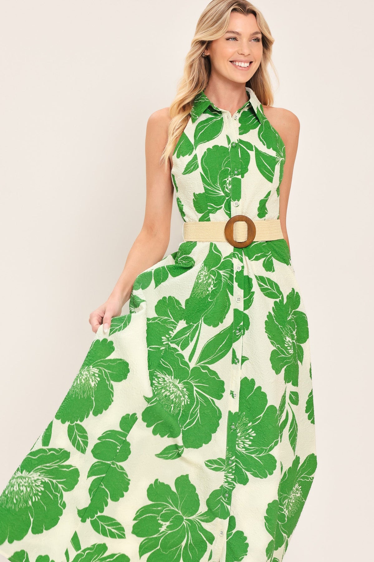 a woman in a green and white dress