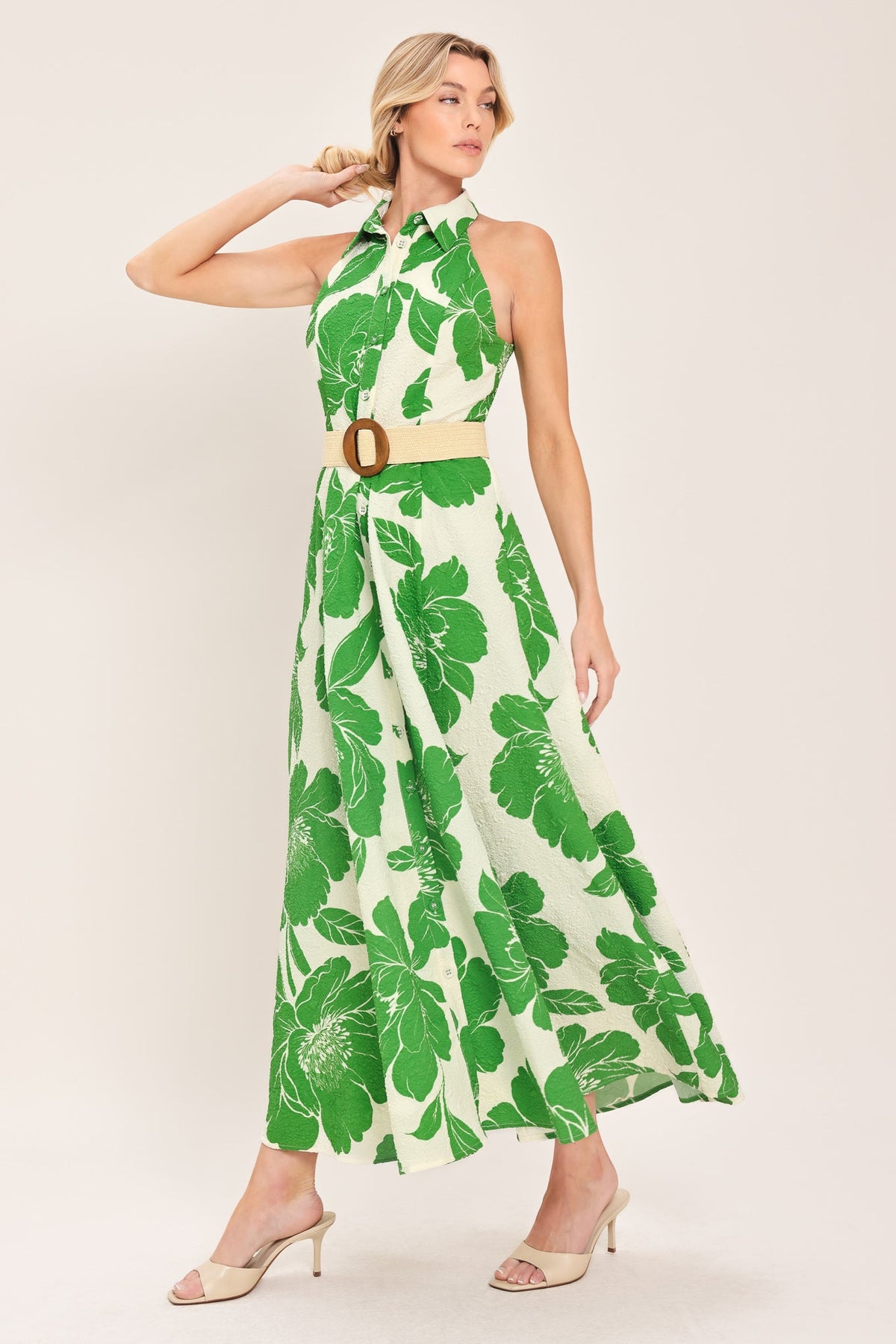 a woman in a green and white dress