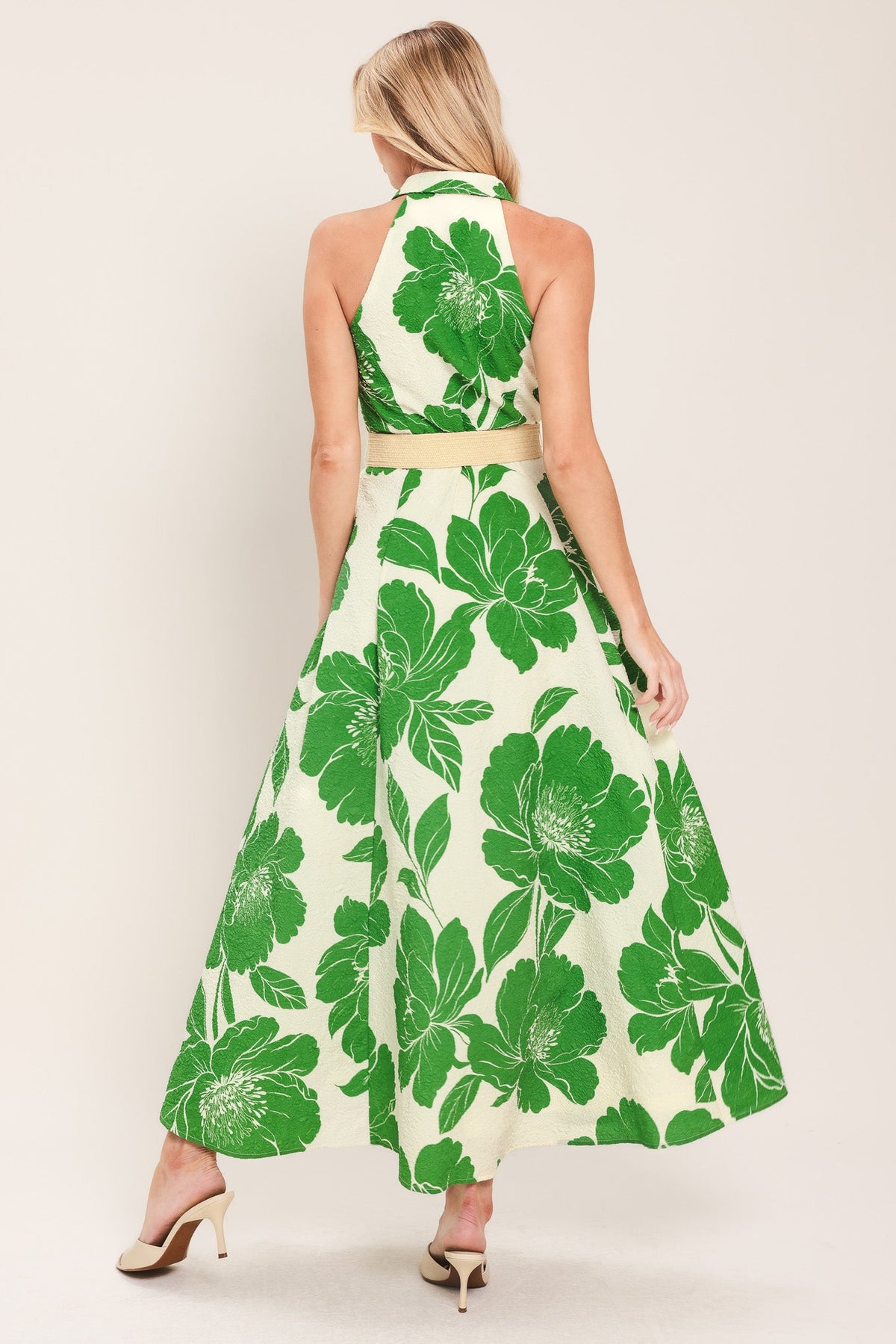 a woman in a green and white dress