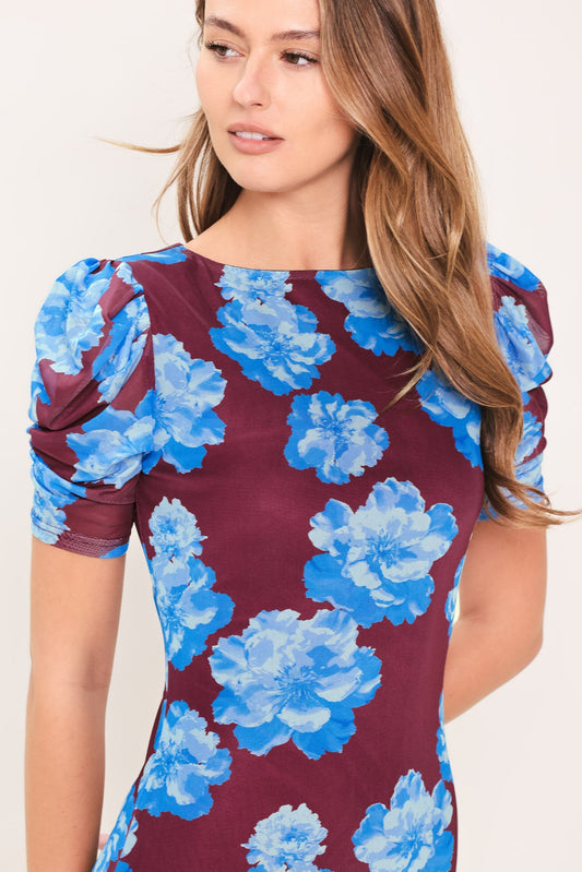 a woman in a floral dress