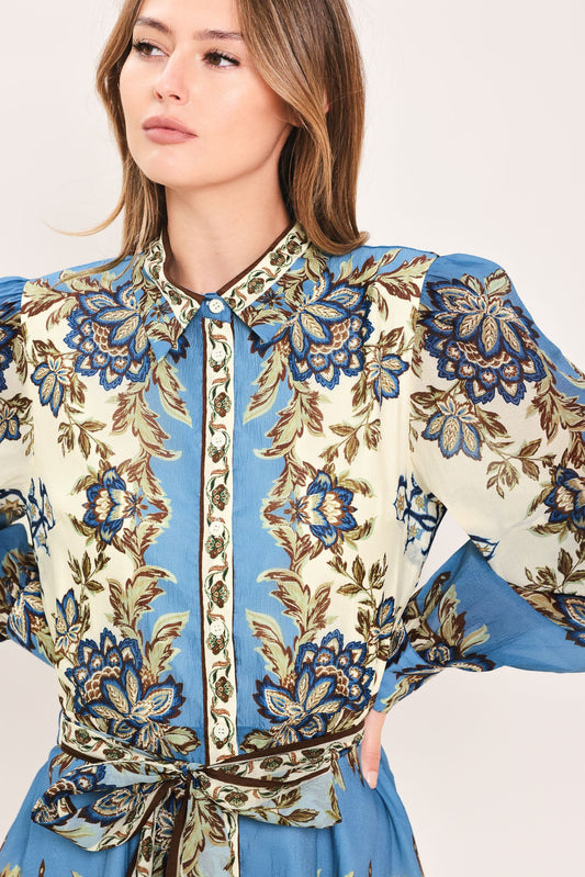 a woman wearing a floral shirt