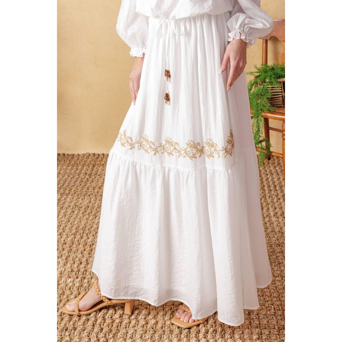 a woman wearing a white dress