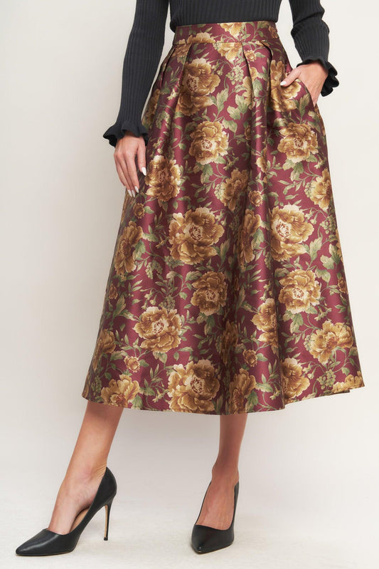 a woman wearing a floral skirt