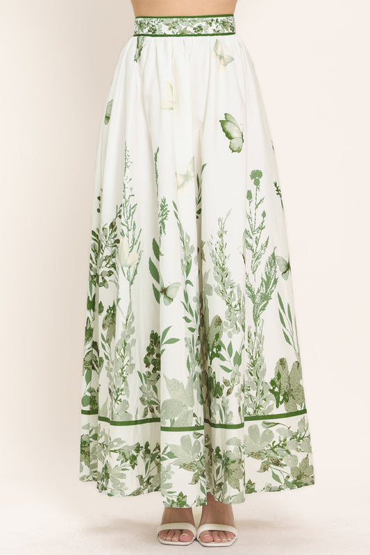a white and green skirt with butterflies on it